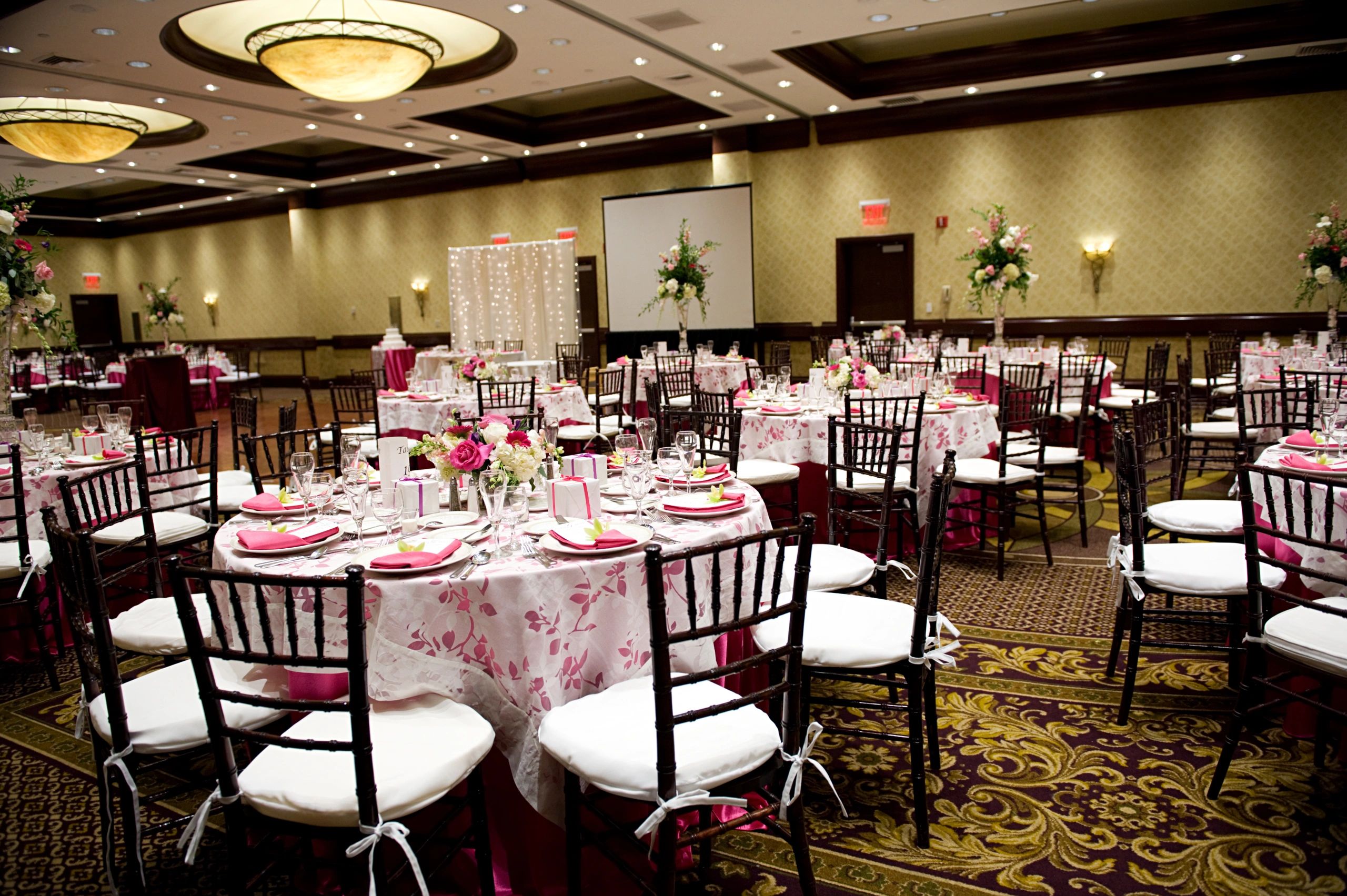 Reception tables arranged in an elegant decorated venue